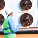 An engineer checks a facility refrigerant system