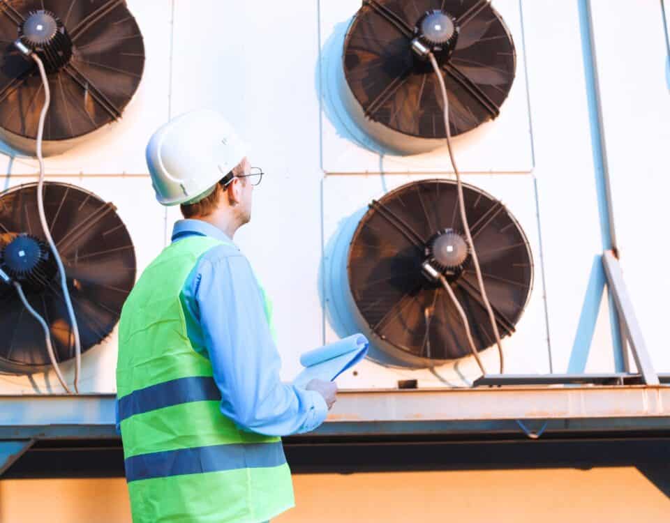 An engineer checks a facility refrigerant system