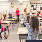 A classroom filled with pupils and a teacher